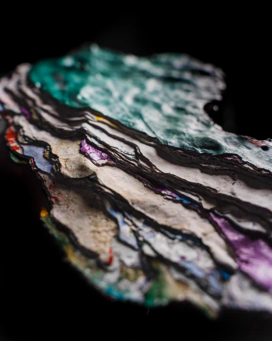 A closeup of colorful paint layers from the Rock