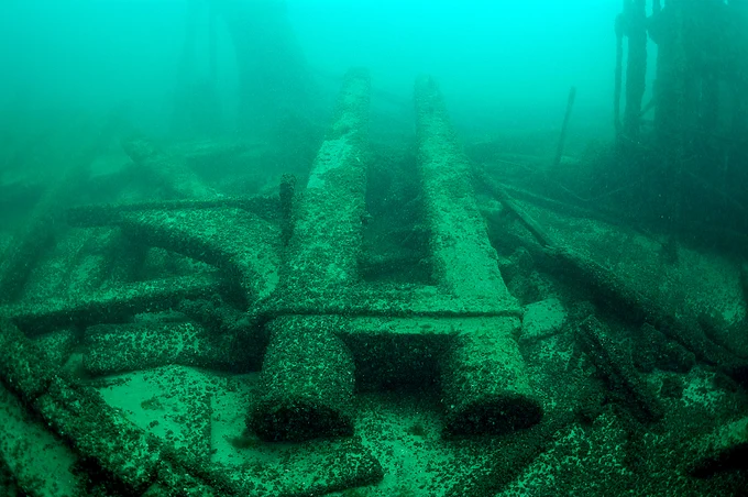 The shipwreck Selah Chamberlain, covered in zebra/quagga mussels, lays at the bottom of Lake Michigan