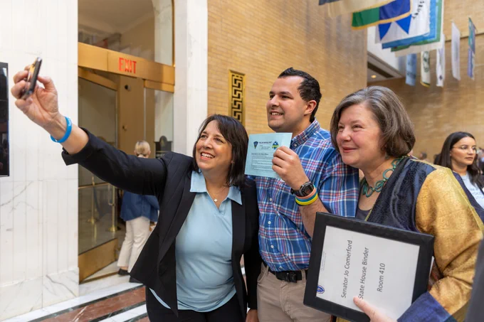 LG Driscoll taking selfie with attendees. 