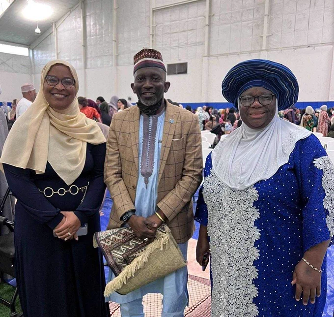PHOTO: Two women and a man posing for a photo at Eid prayer in Nashville.