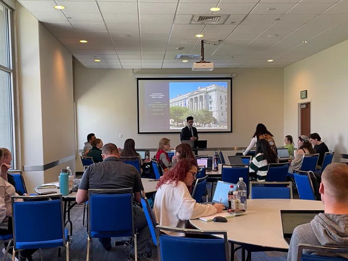 AUSA Sean Mazorol in presenting during BSU's Victims' Rights Week to a room full of students taking notes. 
The slide reads:
Sean M. Mazorol 
Assistant U.S. Attorney District of Idaho 
-Elder financial crimes and exploitation 
-Sextortion 
-April 10, 2024