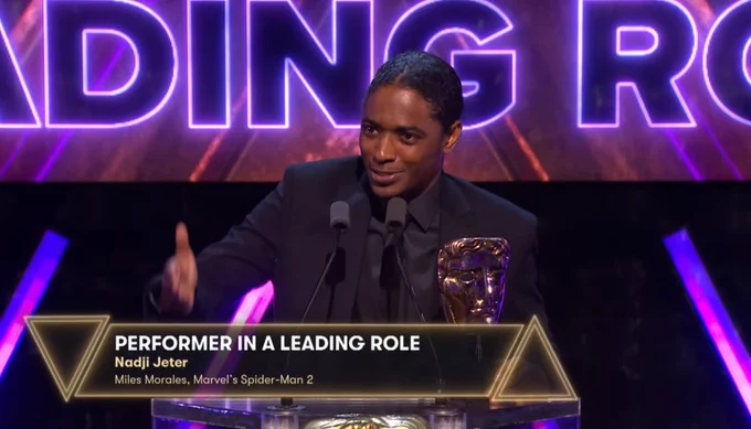 Nadji Jeter accepting the award for Performer in a Leading Role on stage at the BAFTA Game Awards.