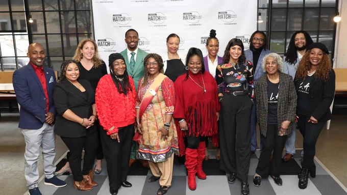 A group photo of the 10 semifinalists of the 2024 Comerica Hatch Detroit Contest. The group is standing in front of a step-and-repeat banner with the Contest logo. 