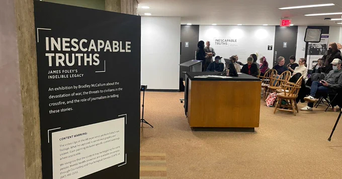 "Inescapable Truths" Banner in front of event reception.