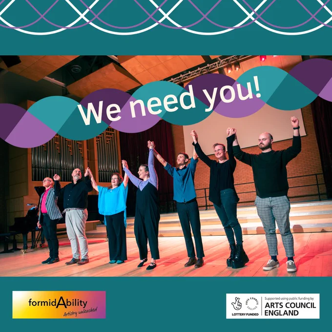 This is a photo of the Song in Sign performance team holding hands for an end-of-performance bow in a wooden floored concert hall. There is a colourful banner graphic which has the text "We need you" over the top of the photo.

In the photo are pianist Nigel Foster, tenor Ben Thapa, soprano Joanne Roughton-Arnold, actor Rhiannon May, actor Petre Dobre,  composer Rylan Clarke and librettist Max Chase.
