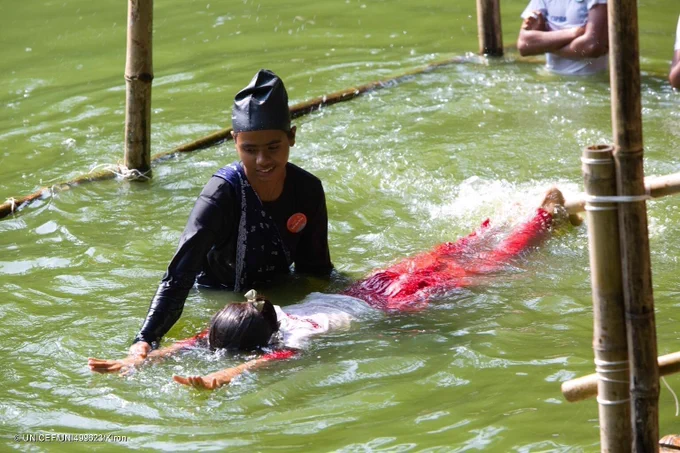 Mim teaches essential swimming skills.
