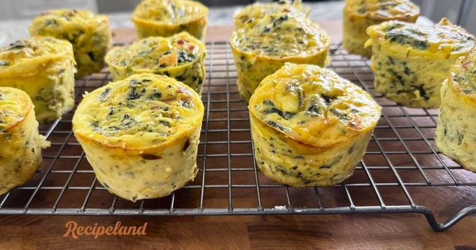 Eggs Florentine Ham & Cheese muffins on a wire cooling rack
