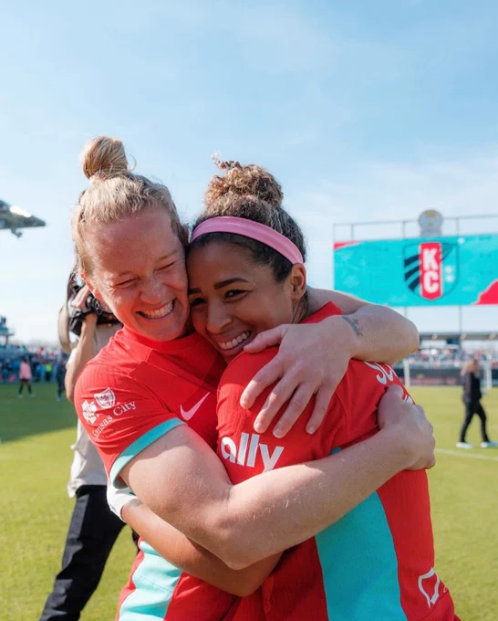 Hamilton and Scott smiling big as they hug each other post-match