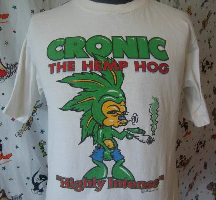 90s vintage shirt that has a depiction of Sonic the Hedgehog as "Cronic the Hemp Hog" where he's green instead of blue, spikes resembling marijuana leaves and grabbing its own crotch while smoking a blunt