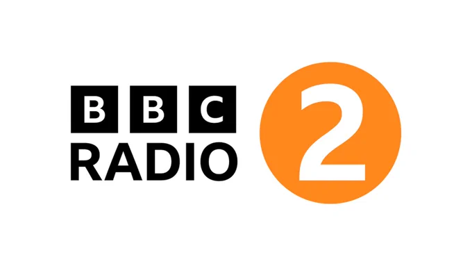 BBC Radio 2 logo. BBC Radio is written in black on a white background alongside a white number 2, enclosed in an orange circle.
