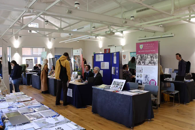 Picture of stalls and attendees at the 2024 Dissertation & Research Fair.