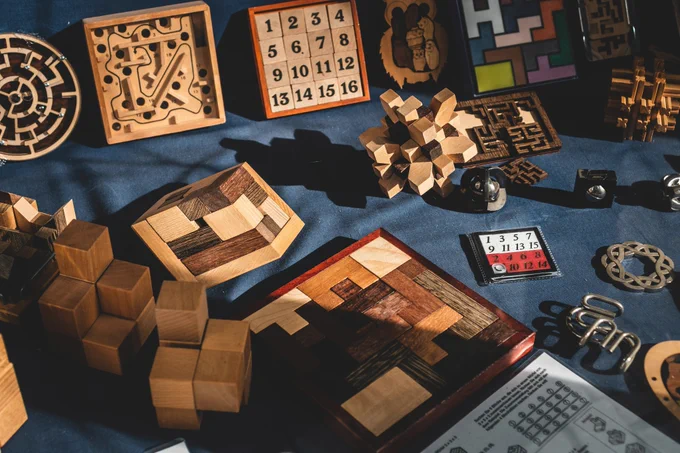 Solved Complex Puzzles sitting randomly on a desk with blue fabric cover

Photo by Jonathan Kemper on Unsplash

https://unsplash.com/photos/brown-wooden-blocks-on-blue-textile-9tamF4J0vLk