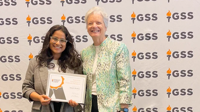 Swati taking a photo with the Vice Provost and Dean of the Graduate School Dixie L. Thompson at the 2024 GSS Meeting.