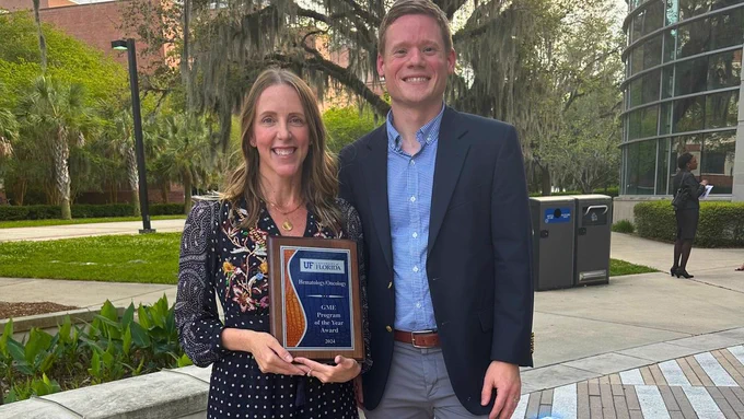 Dr. Murphy and Dr. DeLaune pose for a photo with the fellowship award.