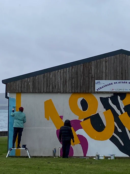Artists painting the boat house