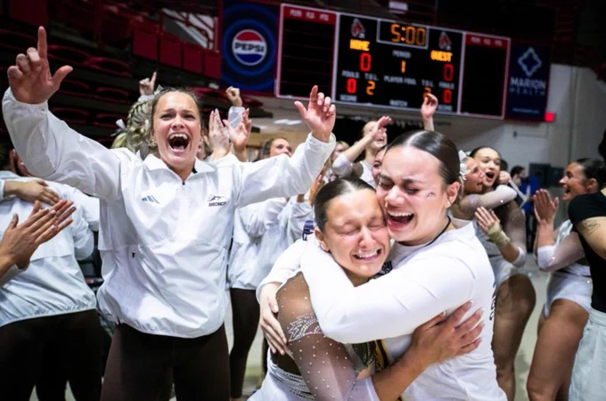 After the big win for the 2024 MAC tournament championship, the Bronco gymnasts hug each other and celebrate. 