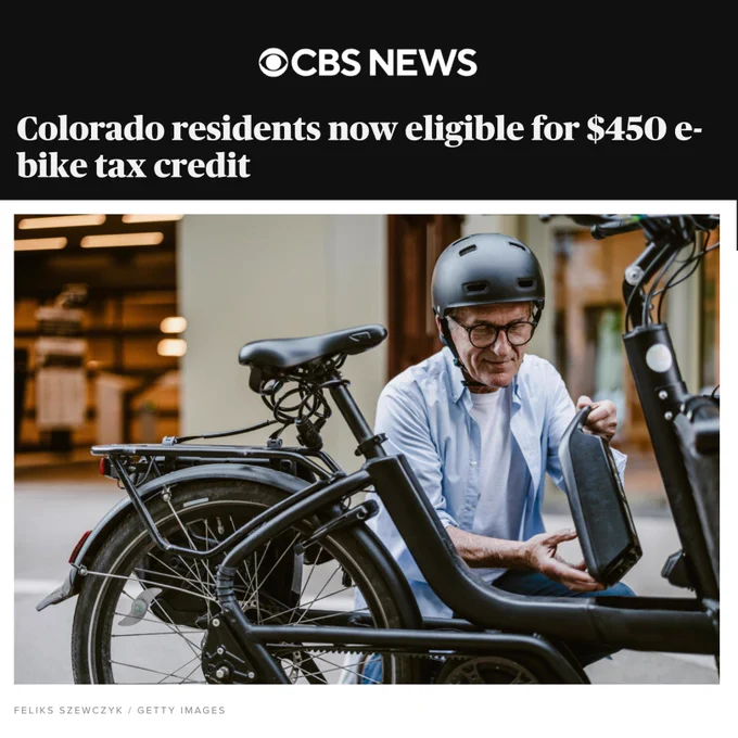Image preview of CBS News article on Colorado E-bike Tax Credit titled: Colorado residents now eligible for $450 e-bike tax credit. Pictured below, a man wearing a helmet, kneeling next to his e-bike.