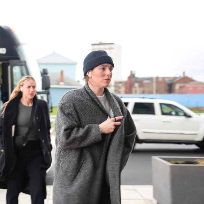 #21 Hilary Knight wears a gray wool jacket while walking into Adirondack Bank Center. 