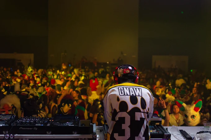 DJ Gnaw overlooking the crowd at Anthrocon's Nightly Dance as he drops some absolute fire on the DJ decks!