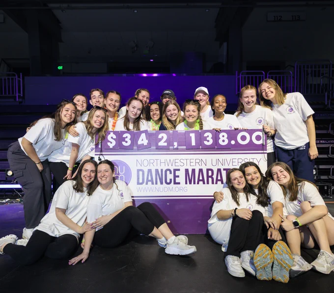 NUDM organizers with a check for $342,138