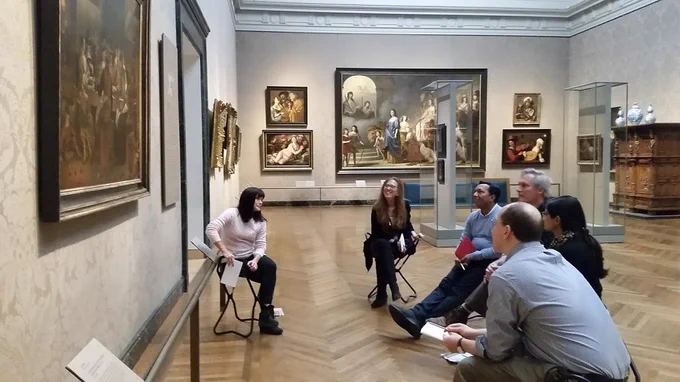 People sitting in a museum.