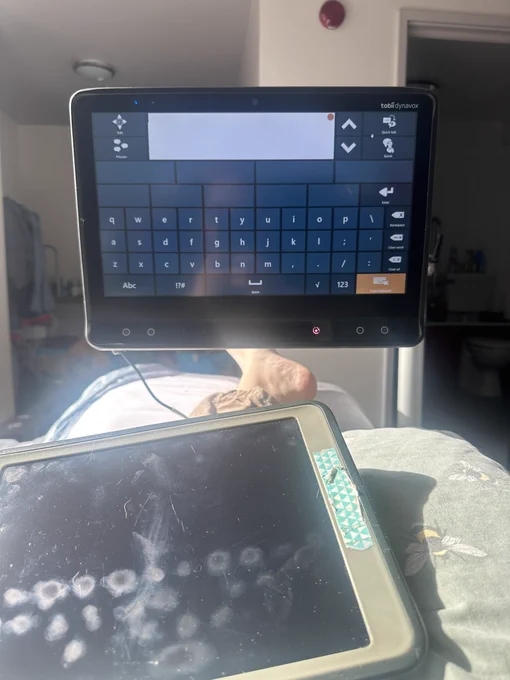 Front view of an eye gaze device with a large keyboard screen.