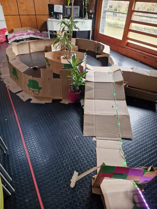 An image of the carboard loop, with a light stream along its path.