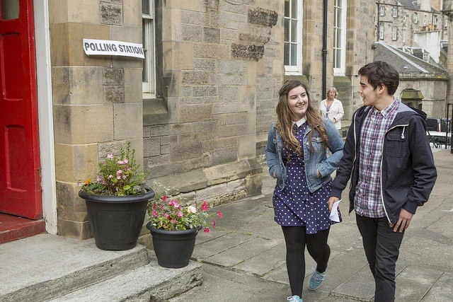 Couple visiting their local polling place during an election