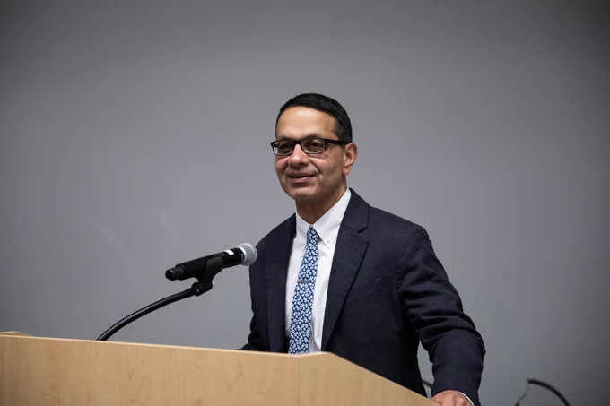 Sanjeev Bhalla, MD, speaks at a podium during the Neville Grant Award ceremony