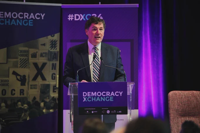 Minister LeBlanc speaking to an audience at the Democracy XChange Summit.