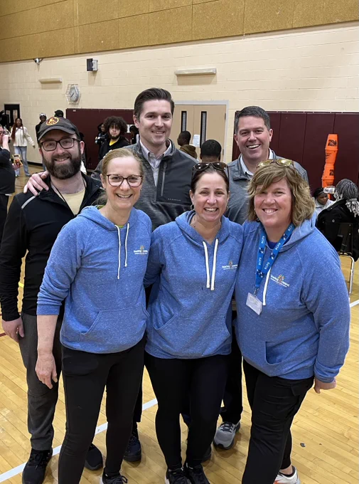 Photo of MSDE team members and BCPS team members smiling in a school gym.
