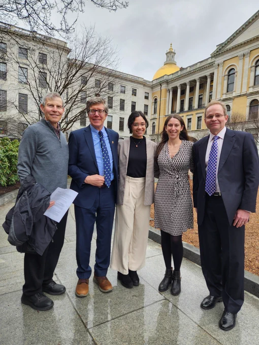 TNC staff and trustees stand in front of the Massachusetts State House.