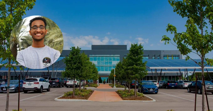 Mohamed Yousuf headshot with a parking lot view of evolve1 in the background