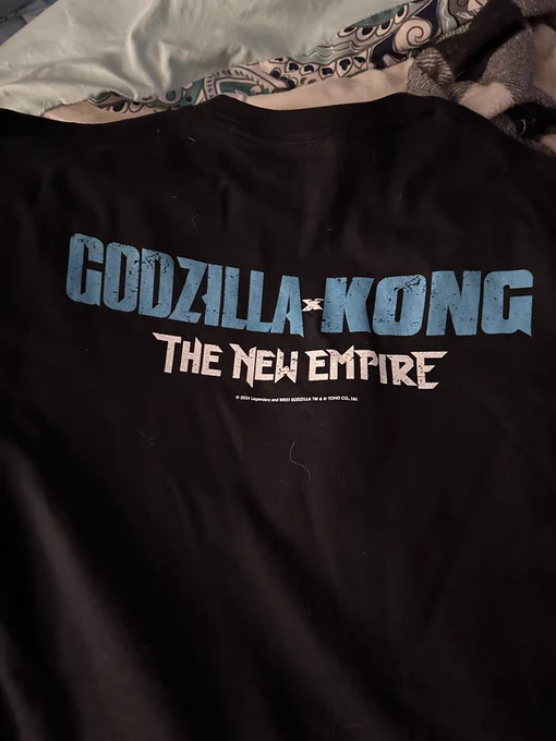 Black T-shirt reading GODZILLA X KONG The New Empire