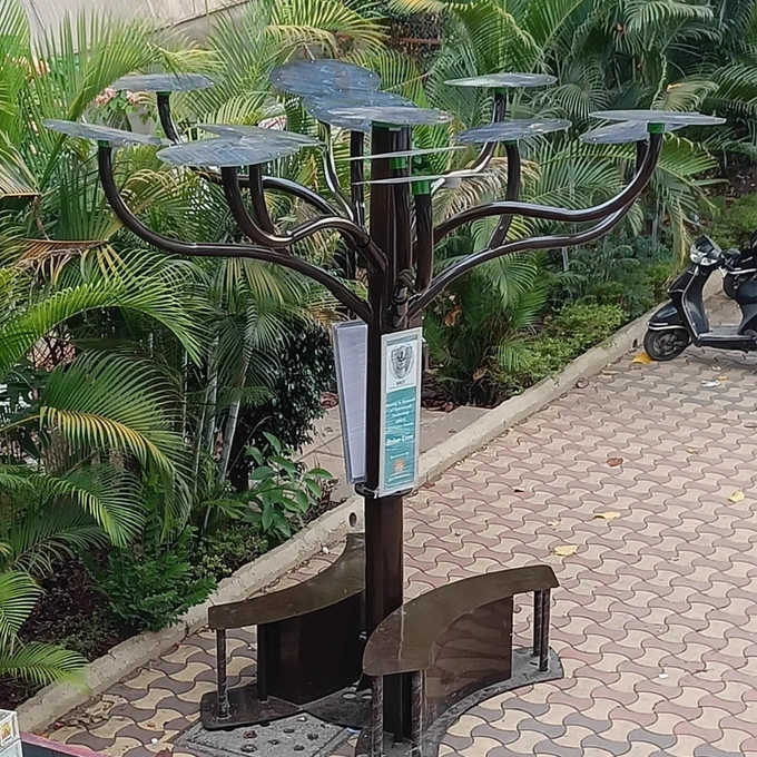 Working of Solar Tree :

Solar tree, as the name suggests, it is combination of various latest of mechanical, electronics and electrical components.
Solar tree is created to look like real tree structure. It has 1 pipe of bigger diameter as a central structure which is considered as a Trunk of solar tree.

It has several pipes which acts as branches of the tree. It has 2 benches where at least 4 people can sit.

As sun rises, electricity generation starts from all panels.Panels with tracking kit tracks the sun for maintaining high efficiency electricity generation. The generated electricity is stored through the connections in the battery.
This stored electricity is used for various applications as per the requirement of Solar Tree

Lets Go Green Go Solar with planting such Solar Tree in Public amenities spaces which will really be harnessing free Solar Power generated to its optimum usage in Eco-freindly & Pocket-friendly both simultaneously.

Do ConnecT with us for more information.
