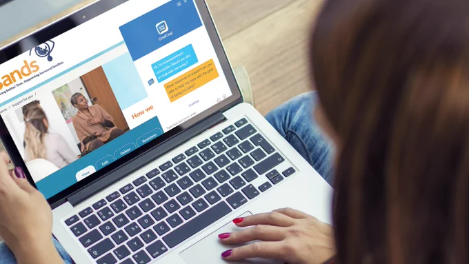 Image of woman accessing GriefChat on her laptop