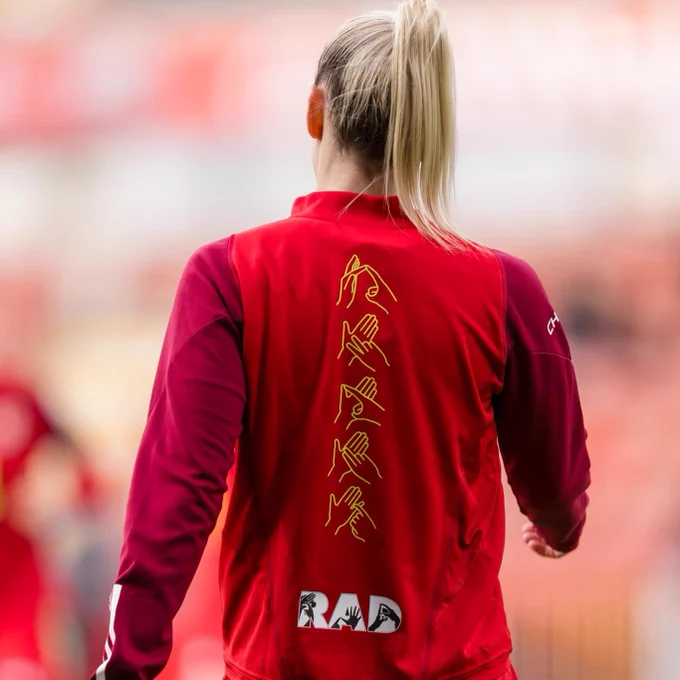 FA Wales training jacket with British Sign Language (BSL) fingerspelling and Royal Association for Deaf people (RAD) logo