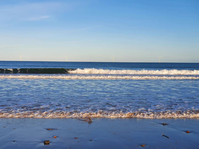 small waves rolling onto the beach