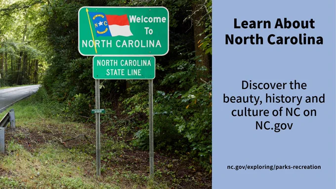 Photo of a welcome to North Carolina highway marker with text: Learn About North Carolina, Discover the beauty, history, and culture of NC on NC.gov.