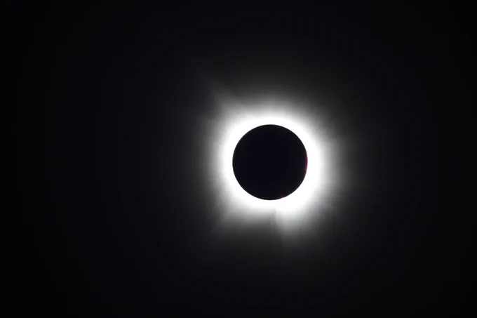 The moon passes in front of the sun over Globe Life Field during Monday's solar eclipse. (Photo: Zack Hefley/Major League Baseball)