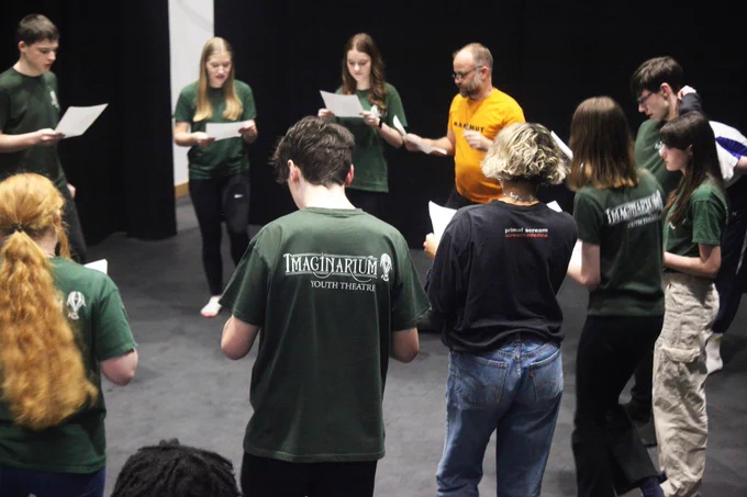 Laurie Sansom working with young people in a circle