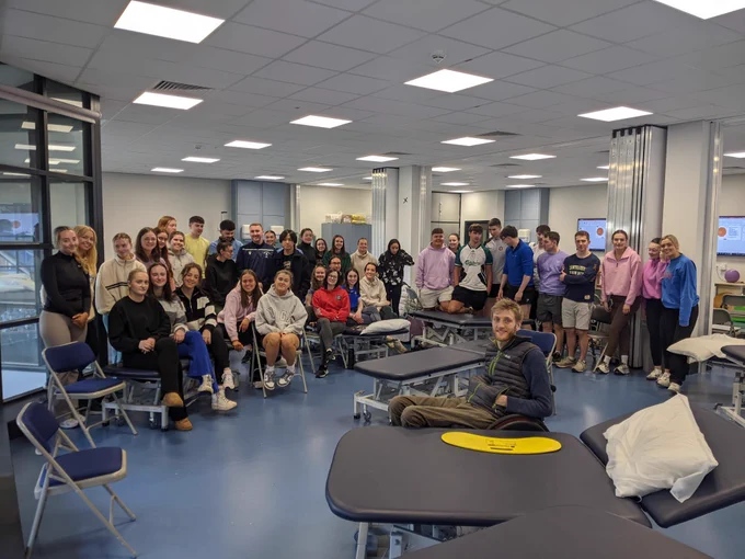 Group of physiotherapy students and expert delivering practical session