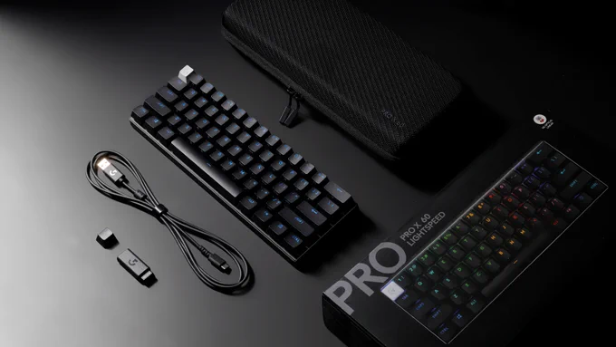 A black Logitech G PRO X 60 unboxed resting next to its components.