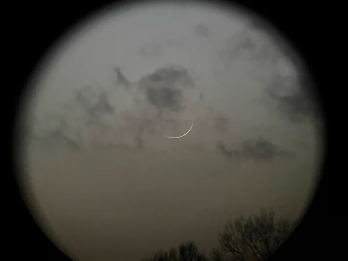View of the moon through binoculars 