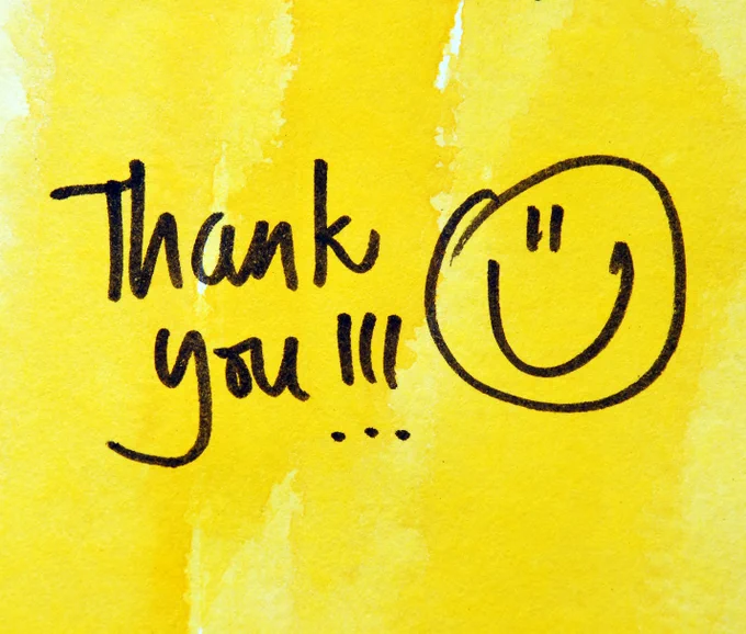 A yellow background, text saying thank you and a drawn smiley face.