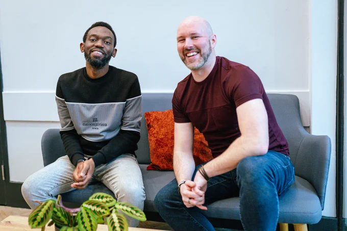 Two people smiling