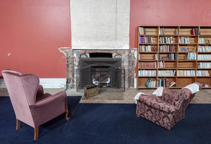 The library & fireplace at Poltimore House