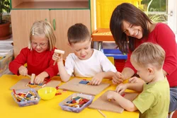 Children and educator in an early learning and childcare setting
