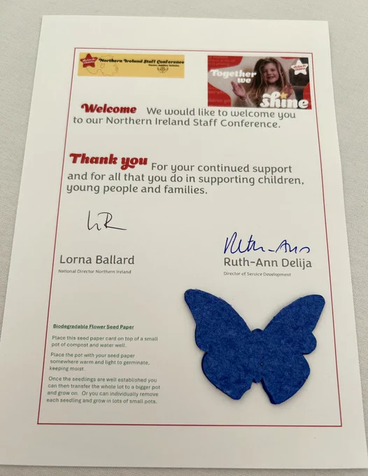 Image shows the welcome card on staff tables and a butterfly shape made from wildflower seed paper.