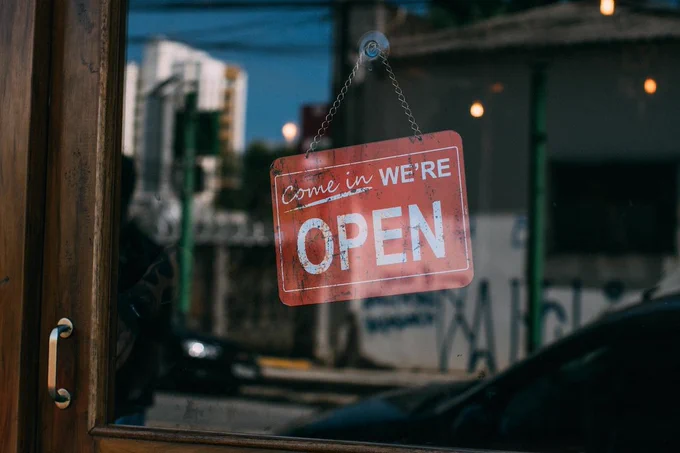An open sign in a window